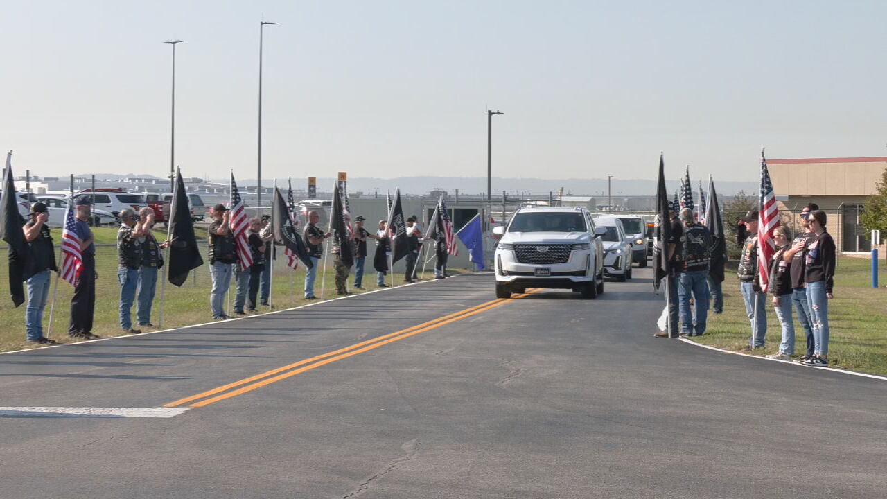 Air Force Staff Sgt. Gerald Gish escort at Louisville Muhammad Ali International Airport